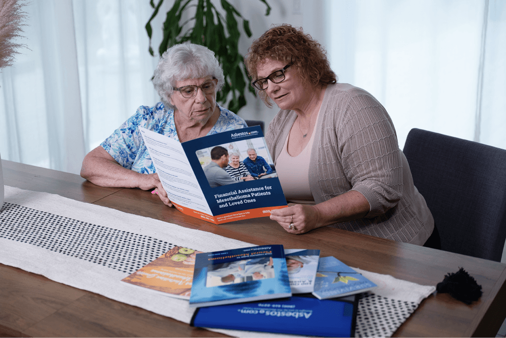 A family reading a free Asbestos.com mesothelioma guide