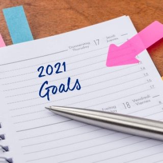 Planner with colored post-its and 2021 goals