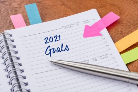 Planner with colored post-its and 2021 goals