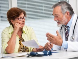Doctor explains exam to patient Doctor explains exam to patient