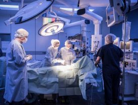 Team of surgeons operating on patient Team of surgeons operating on patient