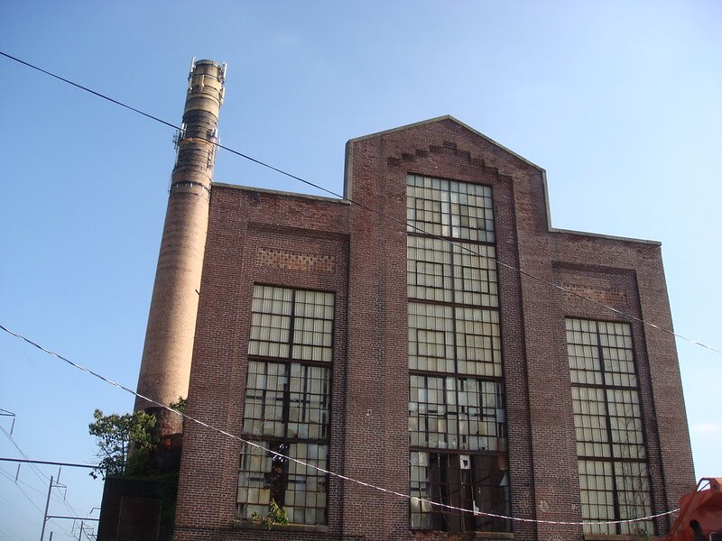 Front face of abandoned brick building at asbestos factory in Ambler, PA