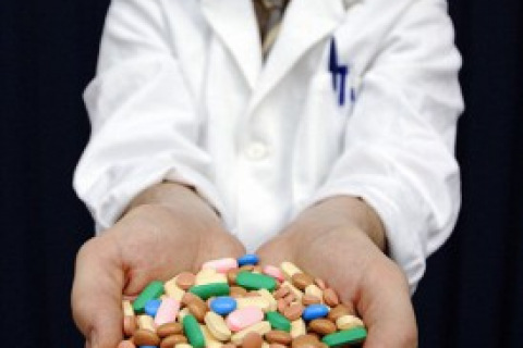 Man holding vitamins