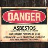 Red and black asbestos warning sign