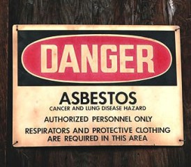 Red and black asbestos warning sign