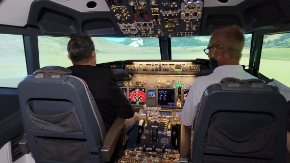 Mesothelioma survivor Daniel McCarthy in Boeing 737 cockpit