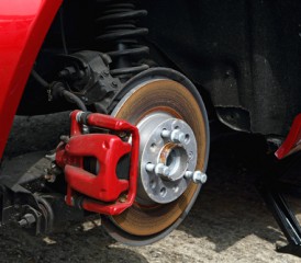 Red brake pads on a car