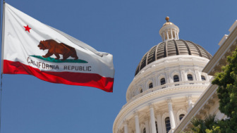 California state capitol with flag