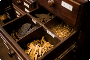 Chinese herbal medicine organized in storage cabinet