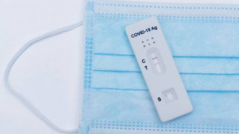 Positive COVID test on blue surgical mask
