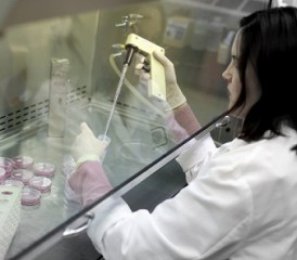 Female scientist taking a sample in a lab