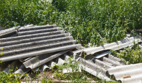 Damaged asbestos roofing material