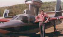 Mesothelioma survivor Daniel McCarthy by a small plane
