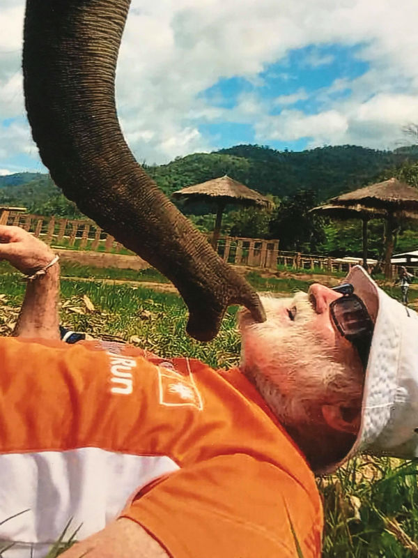 Karen Frantz with her daughter at the beach David Doust regularly travels to Northern Thailand to volunteer for the Save Elephant Foundation.