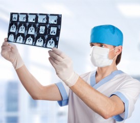 Male doctor examines X-rays
