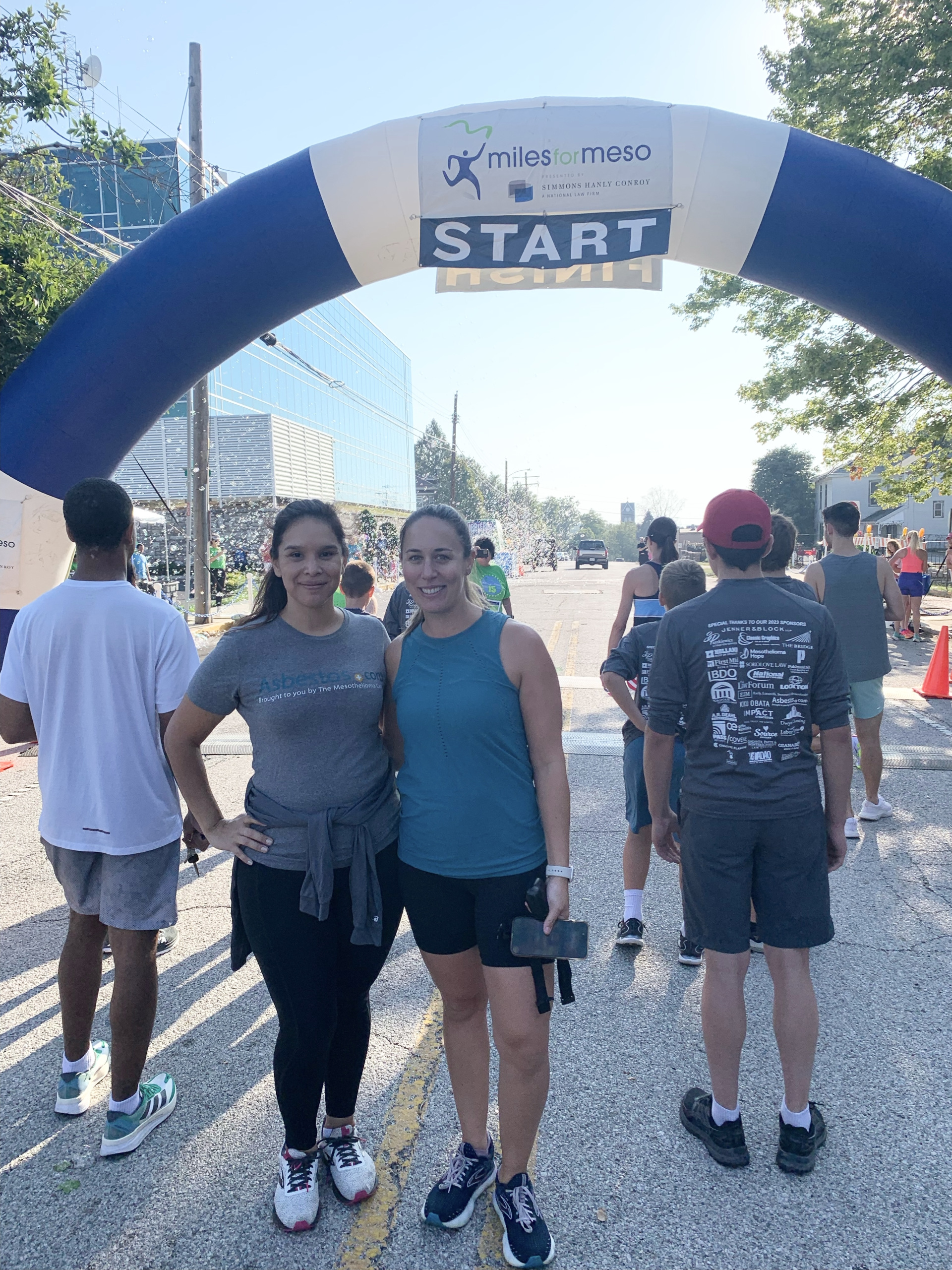 Patient Advocates Vanessa Blanco and Danielle DiPietro under the Miles for Meso start sign in Alton