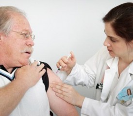 Female nurse injecting a patient