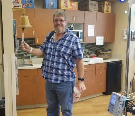 Jim Dykstra rings the last chemo bell