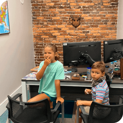 Jose Ortiz's kids in his office at The Mesothelioma Center