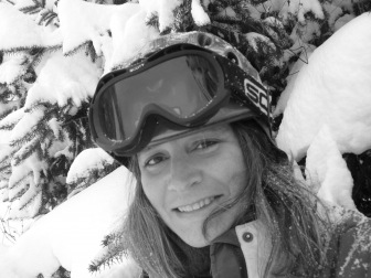 black and white photo of a woman in ski goggles