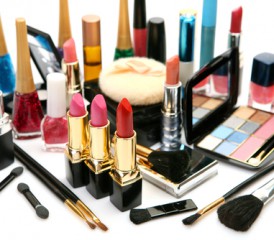 Collection of lipsticks, powders, brushes and other makeup tools