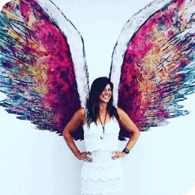 Missy Miller in front of wings artwork