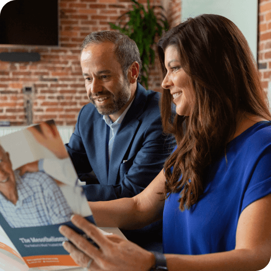 Missy Miller and Jose Ortiz review information guide for mesothelioma patients
