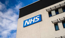 NHS logo on building exterior