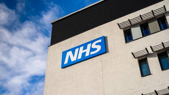 NHS logo on building exterior