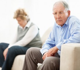 Older couple with man looking upset