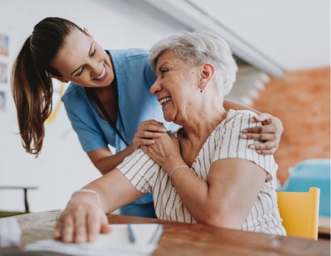 Woman laughing with her doctor