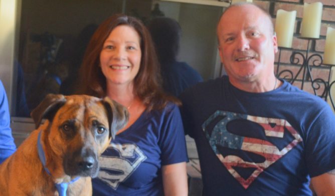 Ron Yutko, peritoneal mesothelioma survivor, with his wife and dog