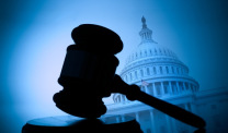 Silhouetted Gavel With U.S. Capitol In Background