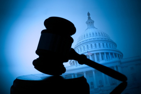 Silhouetted Gavel With U.S. Capitol In Background
