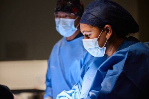 Healthcare worker focused during surgery in hospital