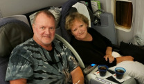 Mesothelioma survivor Doug Jackson and wife Cindy on plane
