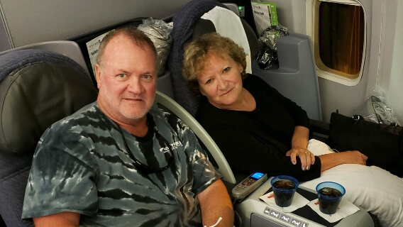 Mesothelioma survivor Doug Jackson and wife Cindy on plane