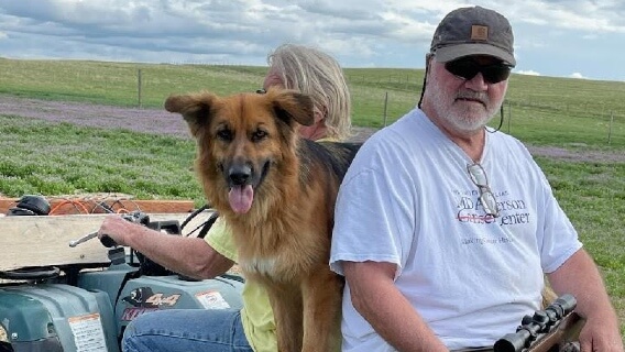 Pleural mesothelioma survivor Doug Jackson and his dog outdoors