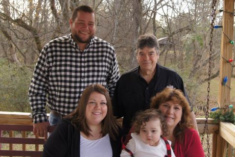 Mesothelioma survivor Tammy Frank (bottom right) and family