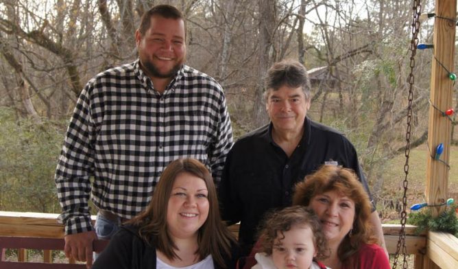 Mesothelioma survivor Tammy Frank (bottom right) and family