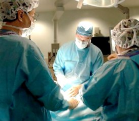 Surgeons operating on a patient