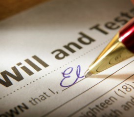 Signing a last will and testament.
