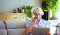Woman using laptop at home