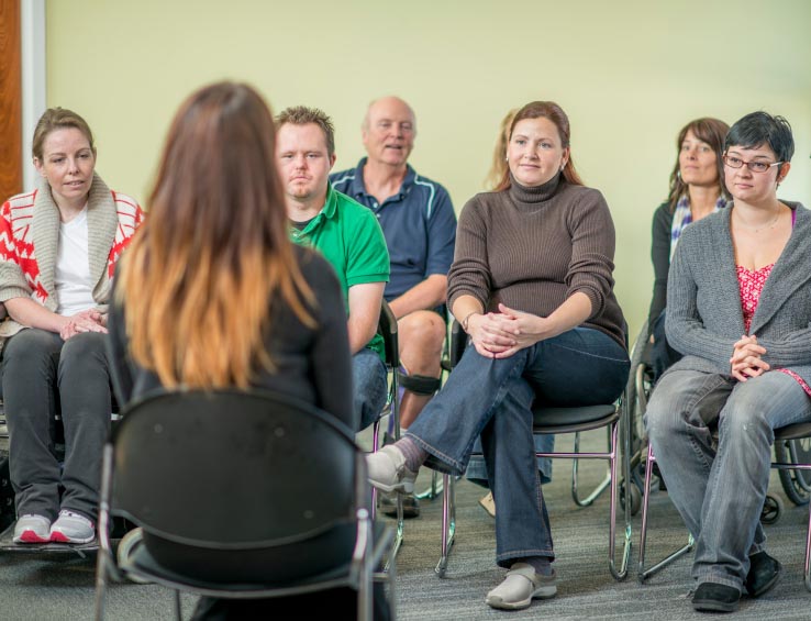 Group of Adults Participating in a Therapy Session Group of Adults Participating in a Therapy Session