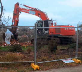 Tractor removing asbestos contamination