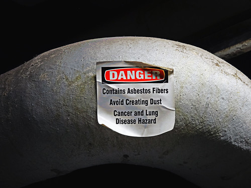 Danger sign, warning of asbestos fibers