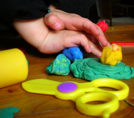 Child playing with modeling clay