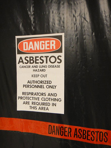 Asbestos warning sign at a jobsite.