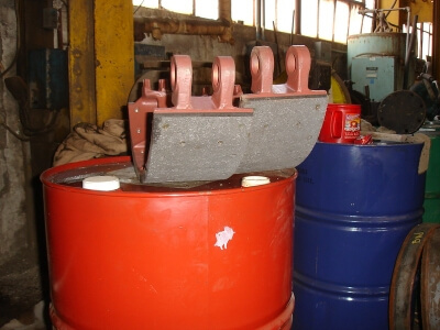 Large asbestos brake pads in steel mill