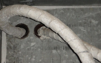 White asbestos wrap covering wires